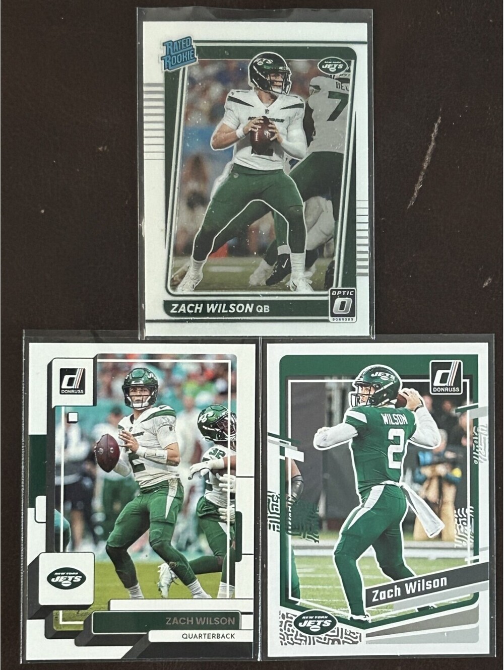 NFL JETS QB 2021 ZACH WILSON PANINI DONRUSS RATED ROOKIE OPTIC RC+ 3 CARD LOT NM